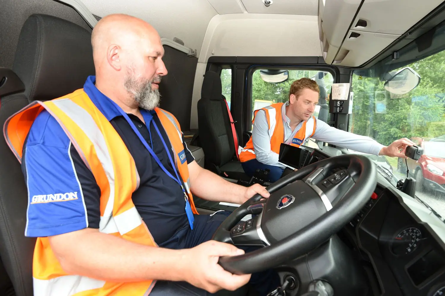 Pictured right Chris Double briefs Jason Warrick on the new AI-led dash cams