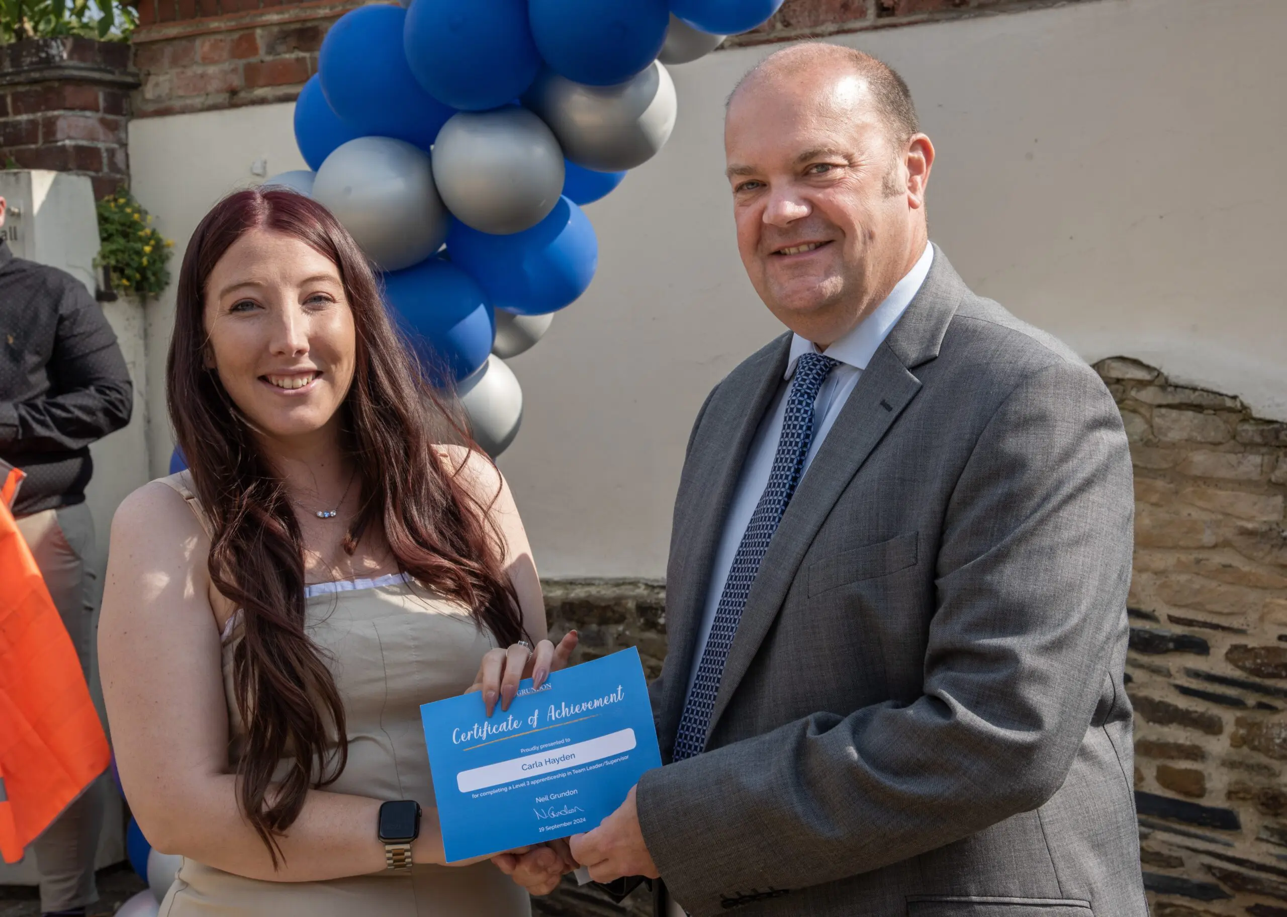 Carla Hayden, Technical Transport Coordinator (left) being presented her Certificate of Achievement with Clayton Sullivan-Webb, Managing Director (right)