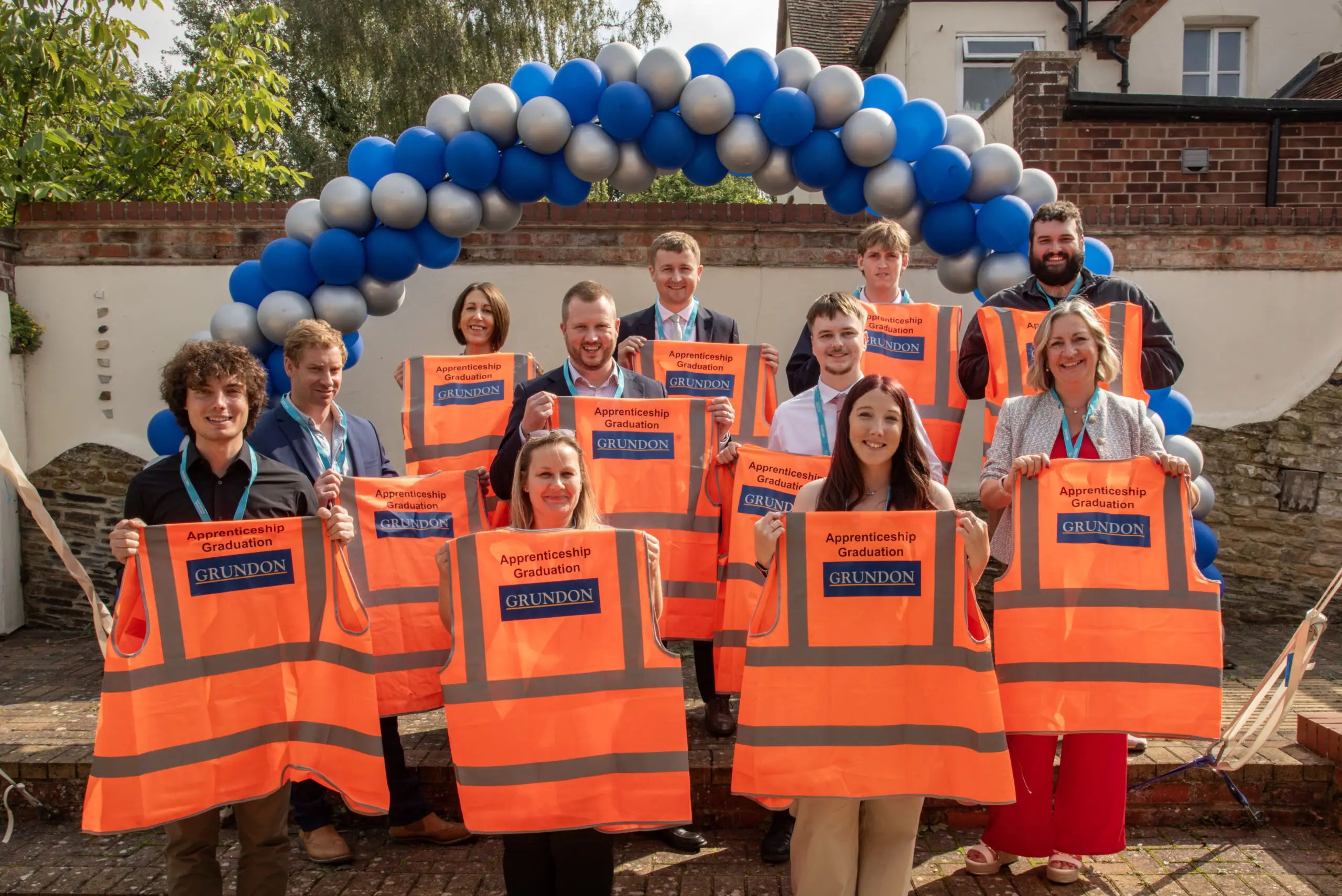 Grundon apprentices celebrate their graduation with bright smiles