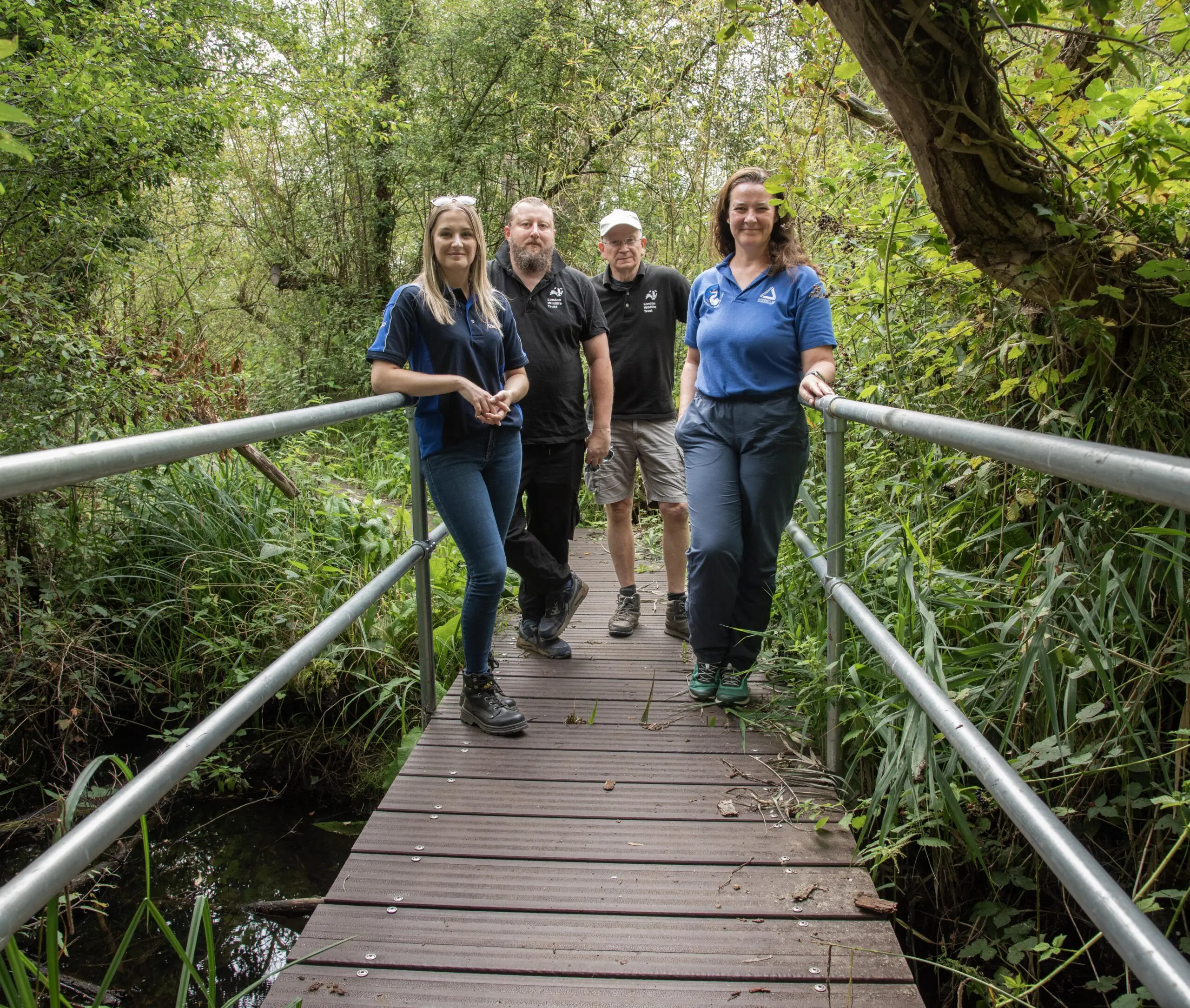 Best foot forward – Kirsti Santer (left) and Michelle Jones (right) are joined by Richard Barnes and Rob Spencer from London Wildlife Trust as they explore the newly-replaced boardwalk at Denham Lock Wood. 